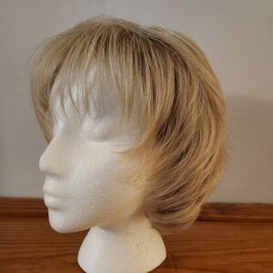 TONI BRATTIN Blonde Medium Length Wig with Side-Swept Style and Volume